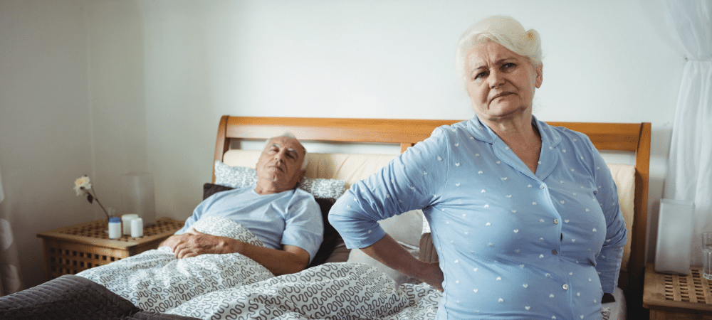 lady with backache on bed